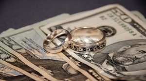 Wedding rings on top of money